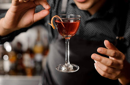 Amehla Co. traditional nick and nora cocktail glasses with Negronis in them being served 'UP'