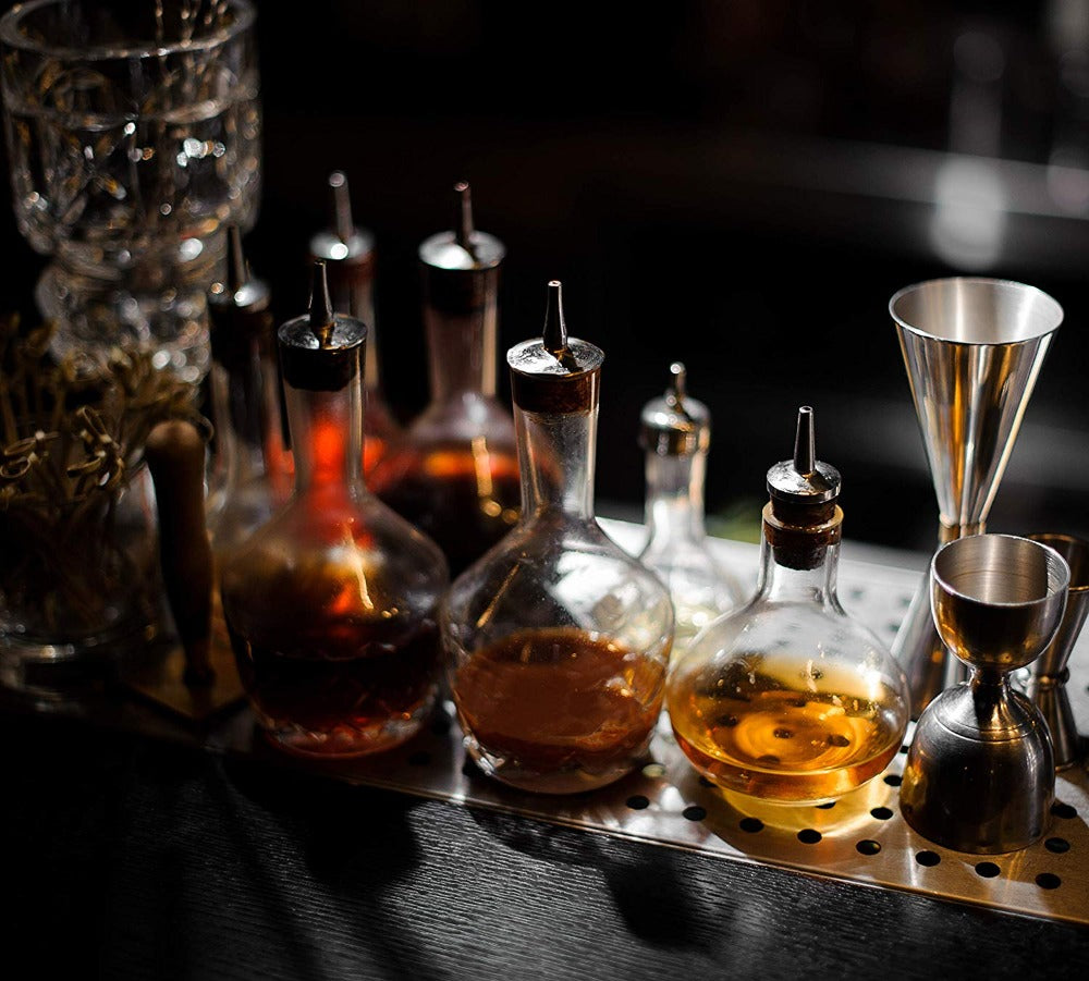 bitters bottle being used at craft bar to make cocktails