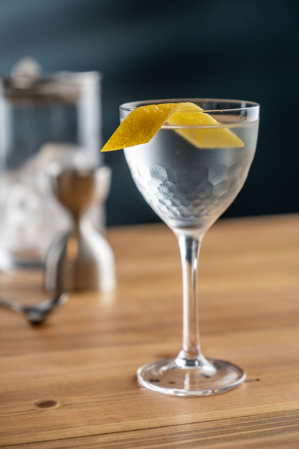 Martini with a lemon twist in an Amehla Co. Honeycomb Nick and Nora cocktail glass. Photo by Jordan Hughes of High Proof Preacher