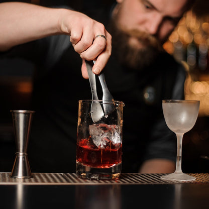 Handblown Seamless Plain Cocktail Yarai Mixing glass from Amehla Co. being used to make stirred cocktail (550ml/ 18 ounce capacity)