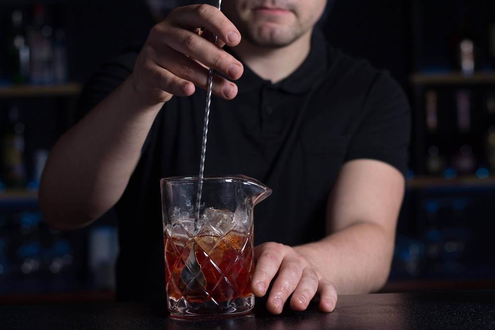 Original yarai cocktail mixing glass from amehla co. being used to stir down a cocktail.