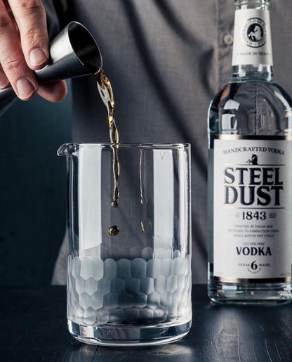 dark liquid being poured into an Amehla Co Honeycomb mixing glass. Photo from Jordan Hughes of High Proof Preacher.